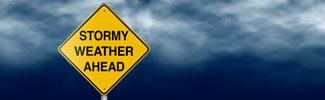 Image of stormy weather with caution sign
